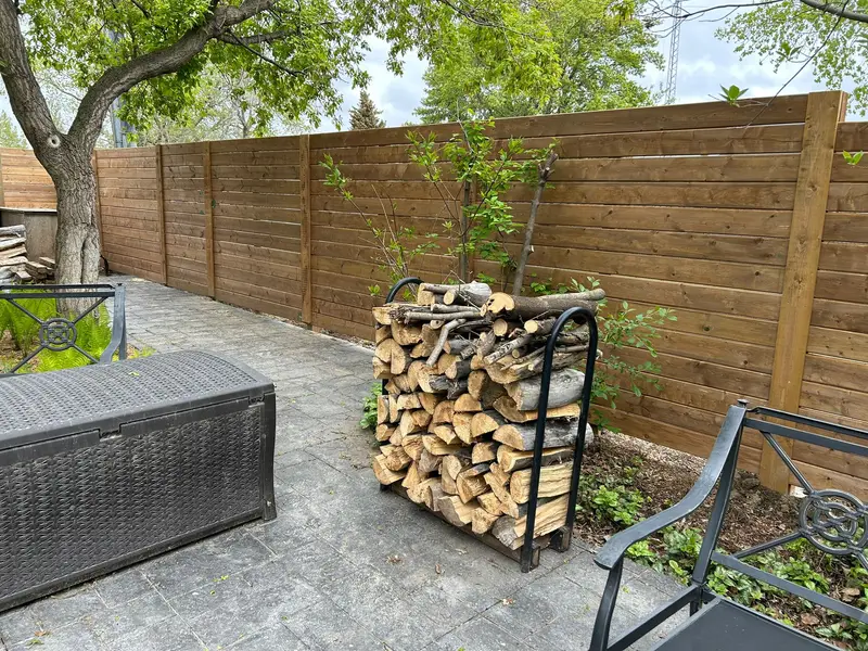 Horizontal Wood Patio Fence Horizontal-slat wood privacy fence around a backyard patio in Saskatoon